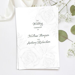 May include: A white wedding ceremony program with floral illustrations. The text reads "The Wedding Ceremony of Mellissa Thompson and Anthony Richardson" in elegant script. The design features a rose and leaf pattern.