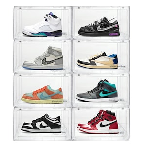 May include: A collection of eight pairs of sneakers displayed in clear plastic shoe boxes. The sneakers feature various color schemes, including white, black, red, blue, and green. Each box is labeled with the text "showcase box".
