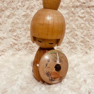 Vintage Creative Kokeshi Doll, with black shield