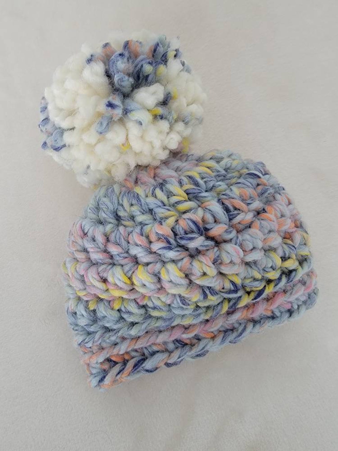 bonnet plusieurs pompons