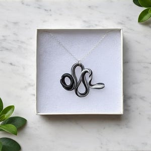 May include: A white ceramic mug with a black handle and the text "But First, Coffee" in a handwritten style. The mug is likely 11-15 ounces, perfect for a morning beverage.