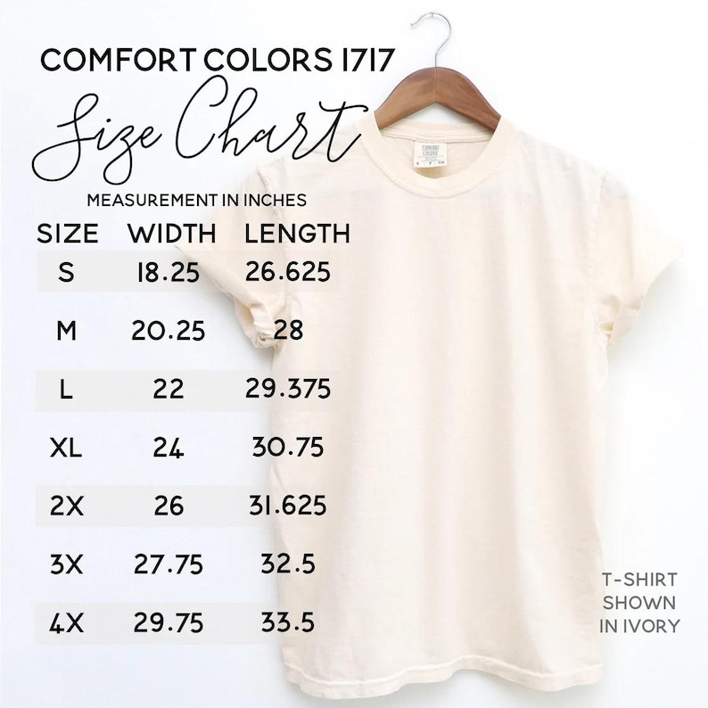 May include: A cream-colored t-shirt hanging on a wooden hanger, with a size chart displayed. The chart lists sizes S to 4X, with width and length measurements in inches. The text "COMFORT COLORS 1717" and "Size Chart" are visible.