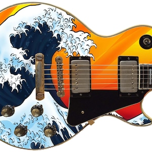 May include: A black electric guitar with a custom design featuring a large blue wave with white foam crashing over a red and orange sunset. The guitar has a black pickguard and a black headstock.