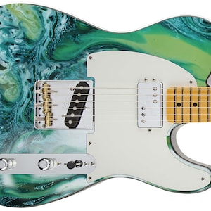 May include: A teal and green electric guitar with a white pickguard and a marbled finish. The guitar has a maple neck and a rosewood fingerboard.