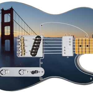 May include: A blue electric guitar with a mirrored finish that reflects an image of the Golden Gate Bridge in San Francisco, California.