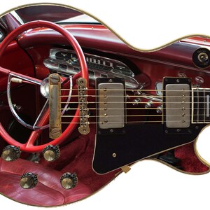 May include: An electric guitar with a red car interior design. The body of the guitar features a red steering wheel, dashboard, and seats. The guitar has a black pickguard, silver pickups, and a white fretboard.