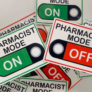 May include: A set of four stickers with the text "Pharmacist Mode" and a toggle switch graphic. Two stickers have the switch in the "ON" position with a green background, and two stickers have the switch in the "OFF" position with a red background.