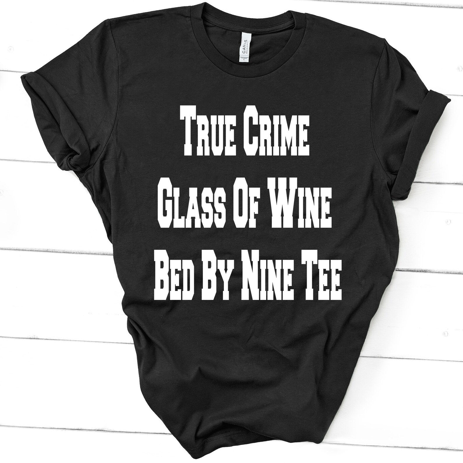 true crime glass of wine in bed by nine shirt