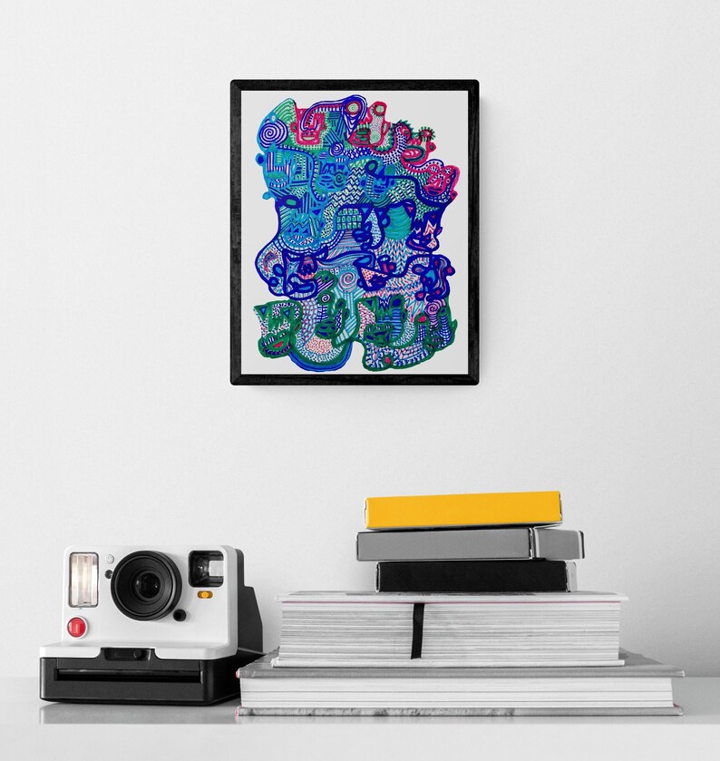 May include: A framed print of a colorful abstract drawing with blue, green, pink, and purple lines and shapes. The drawing is framed in black and is hanging on a white wall.