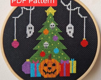 May include: Cross-stitch pattern in a wooden hoop featuring a Halloween-themed Christmas tree with skull ornaments, a jack-o'-lantern, and wrapped gifts. The design includes hanging ghost ornaments and the text "PDF Pattern" in a red box.