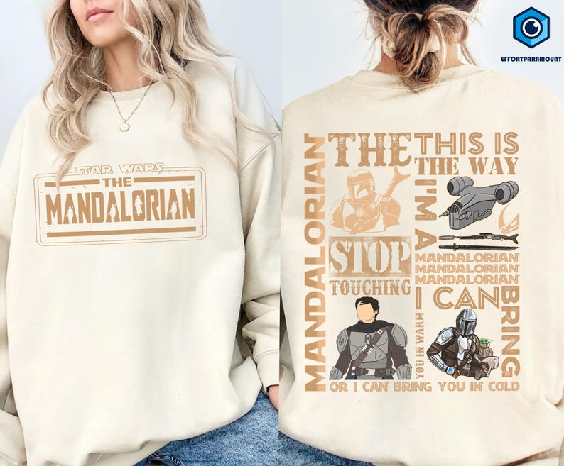 Puede incluir: Sudadera color crema con el logotipo y gr&aacute;ficos de "Star Wars: The Mandalorian". La parte delantera muestra el t&iacute;tulo del programa en un dise&ntilde;o rectangular. La parte trasera tiene ilustraciones de personajes y frases como "This is the Way".