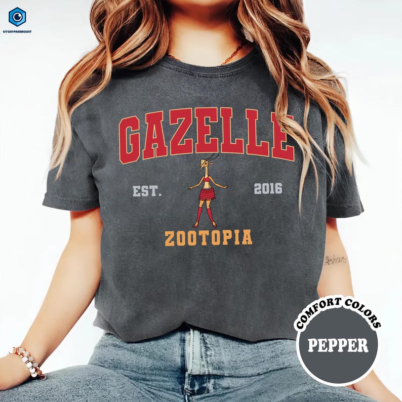 A woman wearing a grey t-shirt with the text "Gazelle" and "Zootopia" printed on it, along with a graphic of a character.