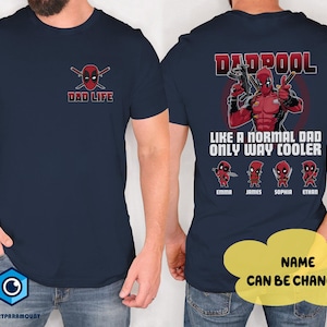 May include: Navy blue t-shirt featuring a Deadpool graphic on the back with the text "DADPOOL LIKE A NORMAL DAD ONLY WAY COOLER". The front of the shirt has a Deadpool logo and the text "DAD LIFE". The names Emma, James, Sophia, and Ethan are below the graphic.