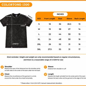 May include: A black acid-wash t-shirt with a size chart labeled COLORTONE-1300. The chart lists sizes S through 3XL with measurements in inches for front length, bust, sleeve, and back length. Includes measurement instructions for shoulder, chest, sleeve, and length.