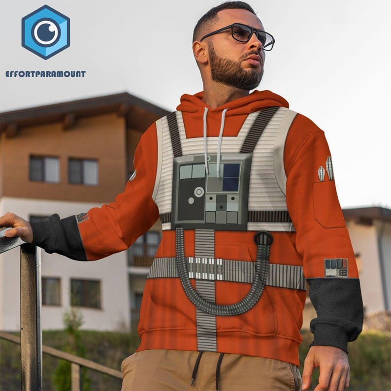 May include: Orange and white hoodie with a Star Wars X-Wing pilot design. The hoodie features a detailed chest panel with a control panel and straps.