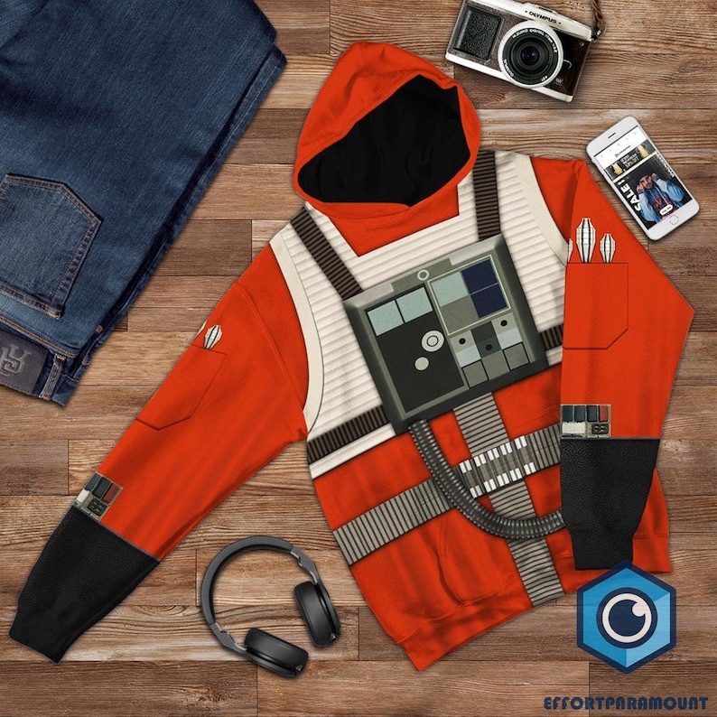 May include: Orange hoodie with a white and black design that looks like a pilot's flight suit. The hoodie has a black hood and black sleeves with white accents.