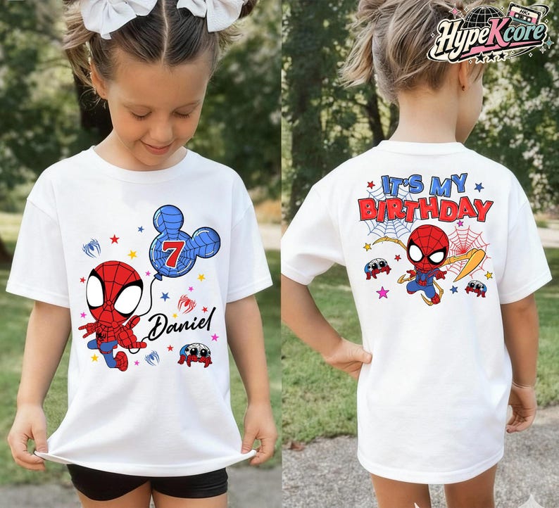 May include: White t-shirt featuring a cartoon Spider-Man design. The front of the shirt has a Spider-Man graphic, a blue balloon with the number 7, and the name "Daniel". The back of the shirt says "It's My Birthday" with Spider-Man graphics.