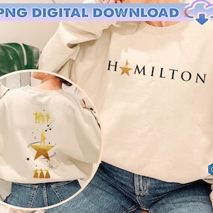 May include: A cream-colored sweatshirt with the word "HAMILTON" printed in black with a gold star. The back of the sweatshirt features a gold star and silhouettes of people. The top of the image reads "PNG DIGITAL DOWNLOAD".
