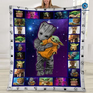 May include: A white blanket featuring a central image of Groot holding Baby Yoda, surrounded by smaller images of the characters. The blanket has a blue border with character illustrations and a purple and blue space background.