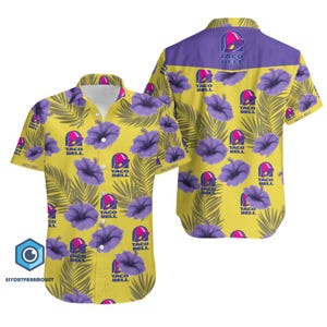 May include: Yellow short-sleeve button-down shirt with a floral and leaf pattern. The design includes purple hibiscus flowers, green leaves, and the Taco Bell logo. The collar and back yoke are purple.
