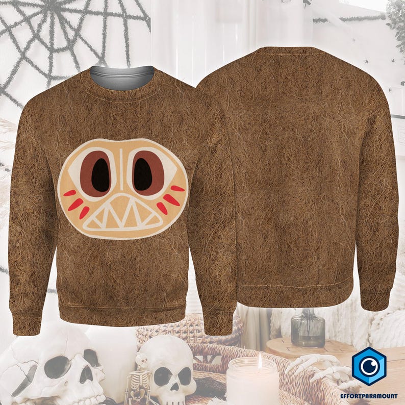 a brown sweater with a large, cartoonish face design on the front.