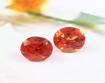 天然ピンクオレンジサファイア 0.64カラット オーバルカット ルース