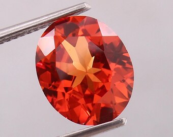 天然ピンクオレンジサファイア 0.64カラット オーバルカット ルース