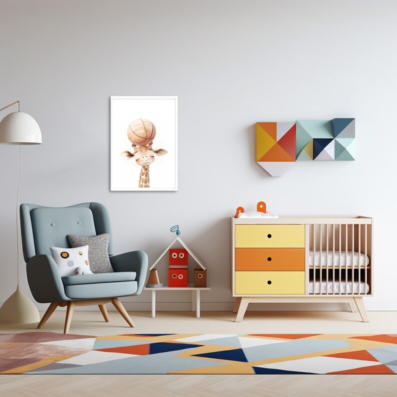 May include: A framed print of a cartoon giraffe holding a basketball above its head. The giraffe is brown with a white face and a light brown neck. The print is on a white background and is framed in a white frame. The print is hanging on a white wall in a nursery.