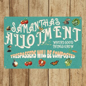 May include: A teal blue metal sign with the text "Samantha's Allotment" in a whimsical font. The sign also includes the text "Where good things grow" and "Trespassers will be composted". The sign is decorated with images of vegetables, a butterfly, a bee, and a mushroom.
