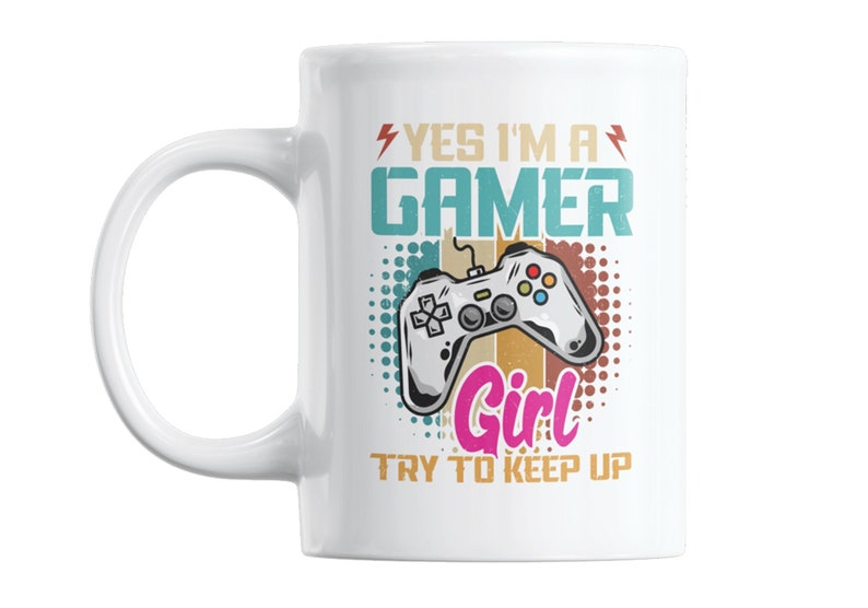 May include: White ceramic mug with a colorful design featuring a video game controller and the text "Yes I'm a Gamer Girl Try to Keep Up".