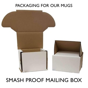 May include: Two cardboard boxes, one with a white interior and one with a brown interior, are open to show the packaging for mugs. The text "PACKAGING FOR OUR MUGS" is at the top of the image. The text "SMASH PROOF MAILING BOX" is at the bottom of the image.