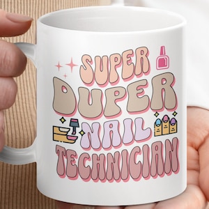 May include: White ceramic mug with a pink, white and brown design. The mug features the text "Super Duper Nail Technician" in a retro font.