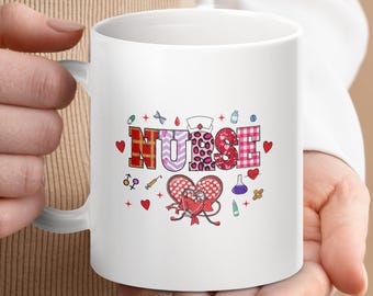 May include: White ceramic mug with a red, pink, and white patterned design that says "NURSE" with a heart and other medical symbols.