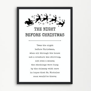 May include: A framed wall art print featuring a black silhouette of Santa in a sleigh pulled by reindeer at the top. Below, the text reads THE NIGHT BEFORE CHRISTMAS followed by the first stanza of the poem in a black typewriter-style font.