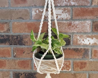 Elegant macrame plant hanger with handmade ceramic pot