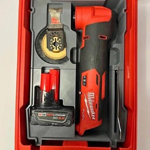 May include: A red and black Milwaukee M12 FUEL oscillating multi-tool kit. The kit includes the tool, a battery, and a blade, all housed in a red plastic case. The tool has a black grip and red accents.