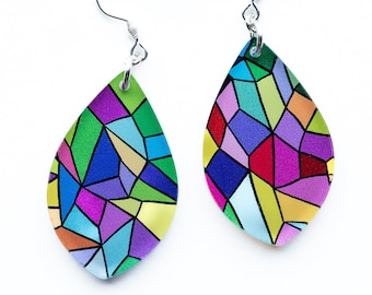 May include: A pair of teardrop-shaped earrings with a colorful stained glass design. The earrings are made of metal and have a silver finish.