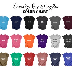 May include: Color chart showing 18 different t-shirt colors. The colors are: Aqua, Navy, Black, Dark Grey, Asphalt, Maroon, Berry, Charity Pink, Orange, Team Purple, Athletic Heather, Dark Grey Heather, Heather Olive, Heather Kelly, Heather Red, Heather Mauve, Heather Navy, and Heather True Royal.