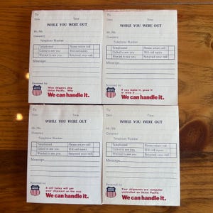 May include: Four vintage "While You Were Out" message pads with the Union Pacific logo. Each pad has space for date, time, and contact information. The pads feature the text "We can handle it."
