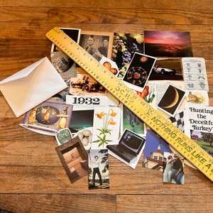 May include: A collection of vintage ephemera, including a ruler, a postcard with the text "1932", a postcard with a crescent moon, a postcard with a car, and a postcard with a turkey. The ruler has the text "NOTHING RUNS LIKE A" and "TALLY-HO" printed on it.