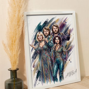 May include: A framed watercolour-style art print featuring the four members of the band ABBA in colourful, sequined stage outfits. The illustration shows two women and two men singing into microphones, with the text ABBA written in the bottom right.