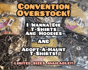 May include: Convention overstock of I Wanna Die and Adopt-A-Haunt t-shirts and hoodies. The image shows multiple packaged shirts and hoodies with various sizes available. The text on the image says "Limited Sizes Available!!"