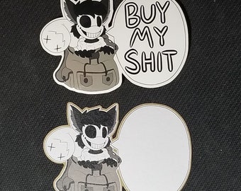 May include: Two stickers featuring a cartoon character with a wide grin and dark fur. One sticker has the text "BUY MY SHIT" in a speech bubble. The other sticker has a blank speech bubble.
