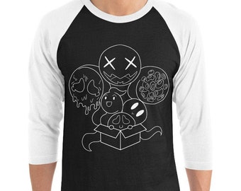 May include: Black and white raglan baseball tee with a graphic of cartoon characters. The design features several smiling faces, a melting skull, and a box with tentacles. The sleeves are white, and the body is black.