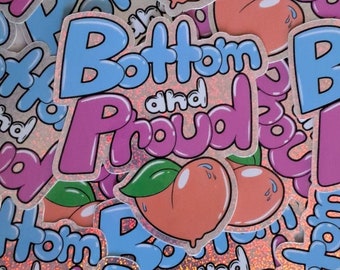 May include: A collection of stickers with a peach graphic and the words "Bottom and Proud" in blue and pink bubble letters. The stickers have a holographic background and a cartoon style.