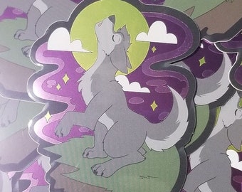 May include: A sticker featuring a cartoon wolf howling at a full moon. The wolf is gray and white, set against a backdrop of purple and green with stars and clouds. The sticker has a glossy finish.