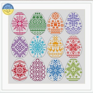May include: A framed artwork featuring twelve vibrantly colored Easter eggs, each adorned with intricate cross-stitch patterns. The eggs display a variety of geometric and floral designs in shades of red, green, blue, orange, and purple.