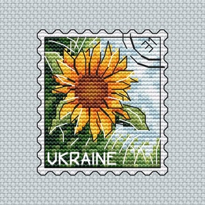 May include: A vintage-style postage stamp with a sunflower design and the word "UKRAINE" printed on it.