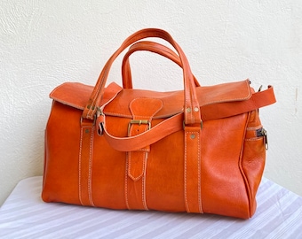 Genuine leather travel bag, handcrafted with love - perfect for adventure and style.