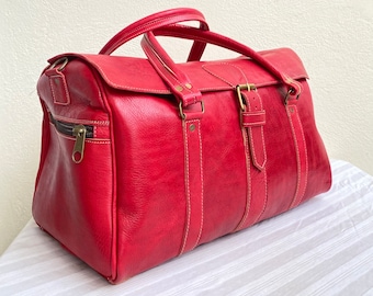 High-end genuine leather travel bag in Red color, 100% handmade.